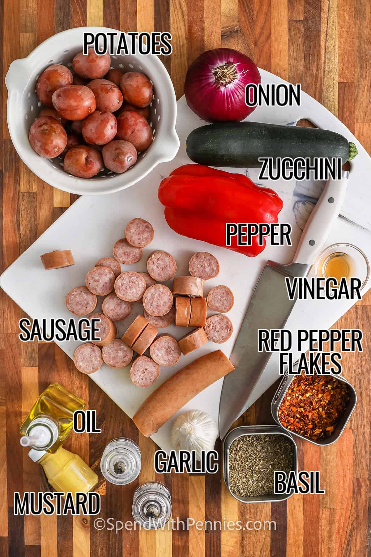 potatoes , onion , zucchini , pepper , sausage , oil , mustard , garlic , basil , vinegar , red pepper glakes with labels to make Roasted Sausage and Potatoes