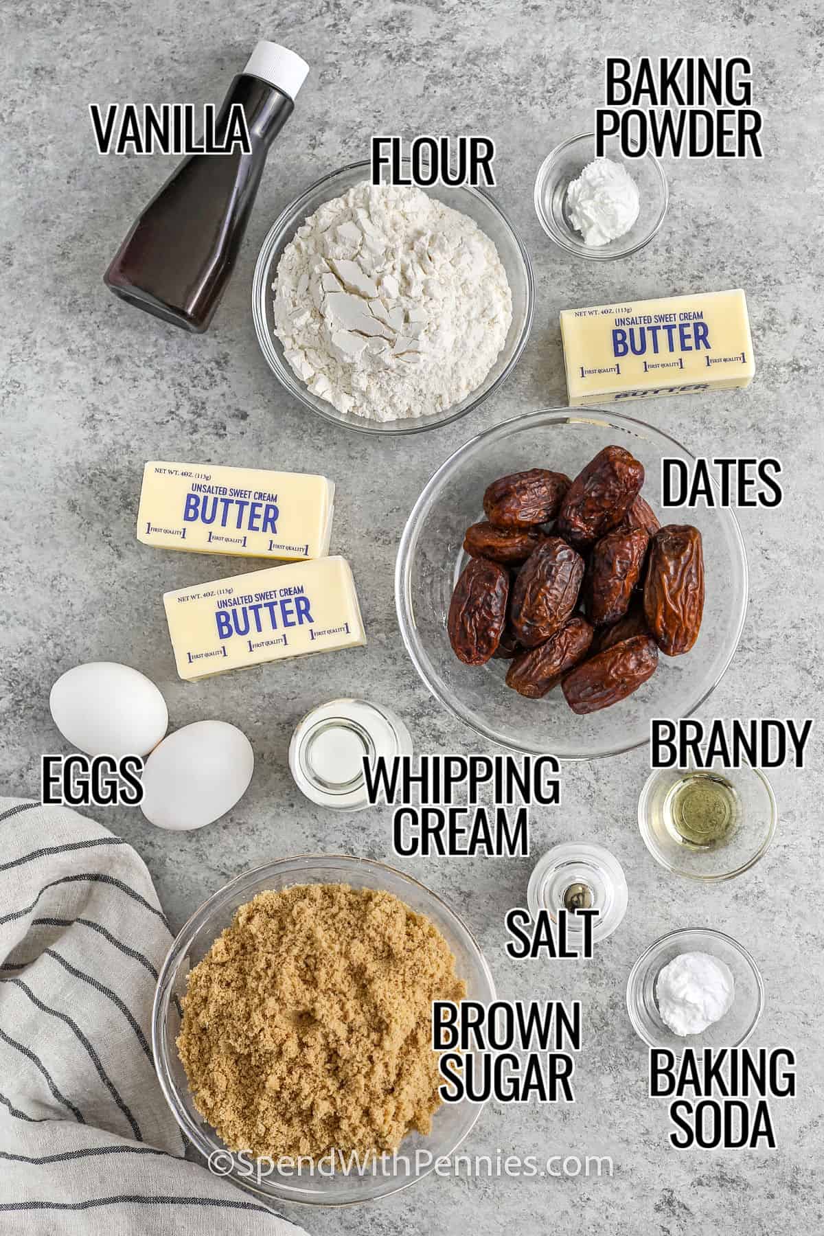 vanilla , flour , baking powder , butter , dates , brandy , whipping cream , eggs , salt , baking soda and brown sugar with labels to make Sticky Toffee Pudding