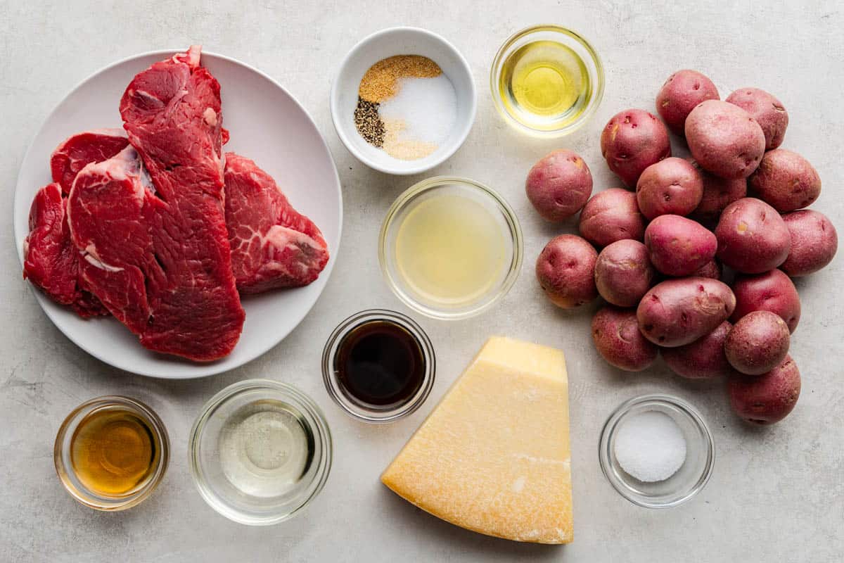 An overhead view of the ingredients needed to make air fryer steak bites and potatoes.