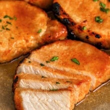 plated Juicy Baked Pork Chops with one cut into slices