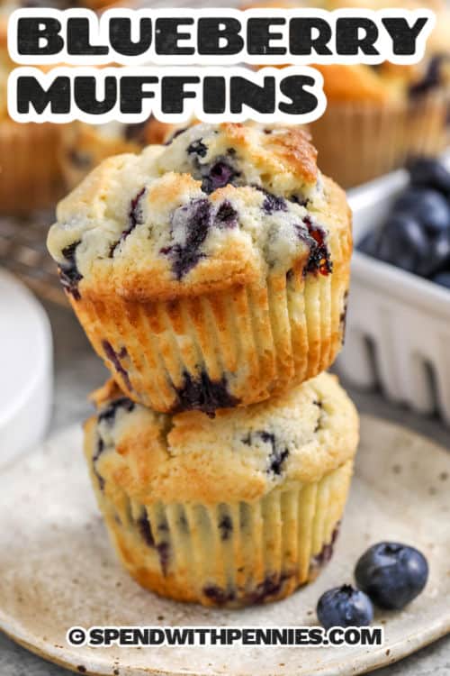 juicy Blueberry Muffins on a plate with a title