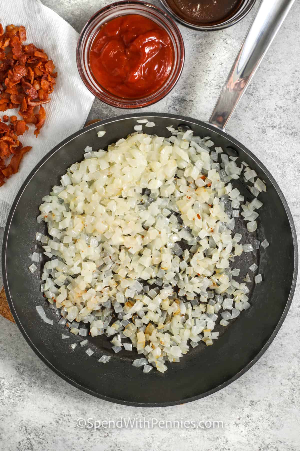 cooking onions to make Slow Cooker Baked Beans