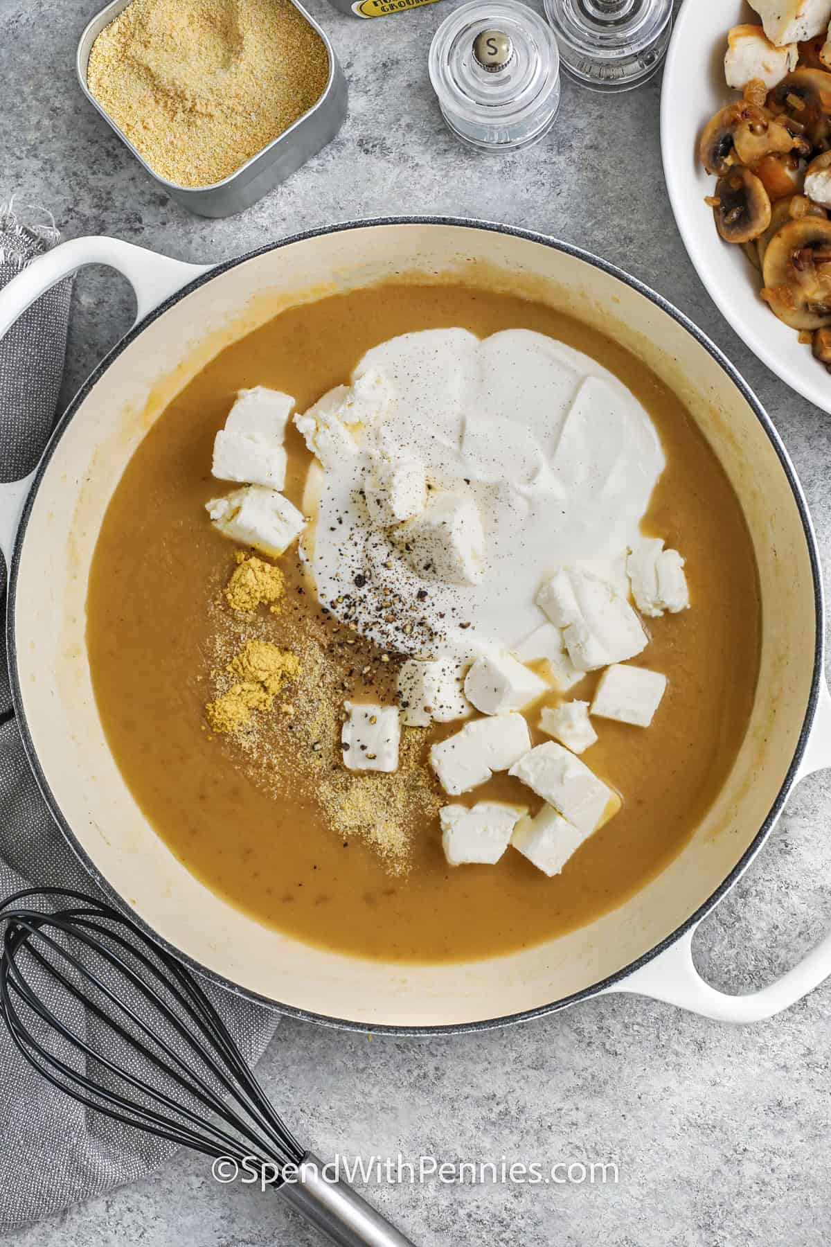 adding cream cheese and sour cream with seasonings to pot to make Chicken Stroganoff