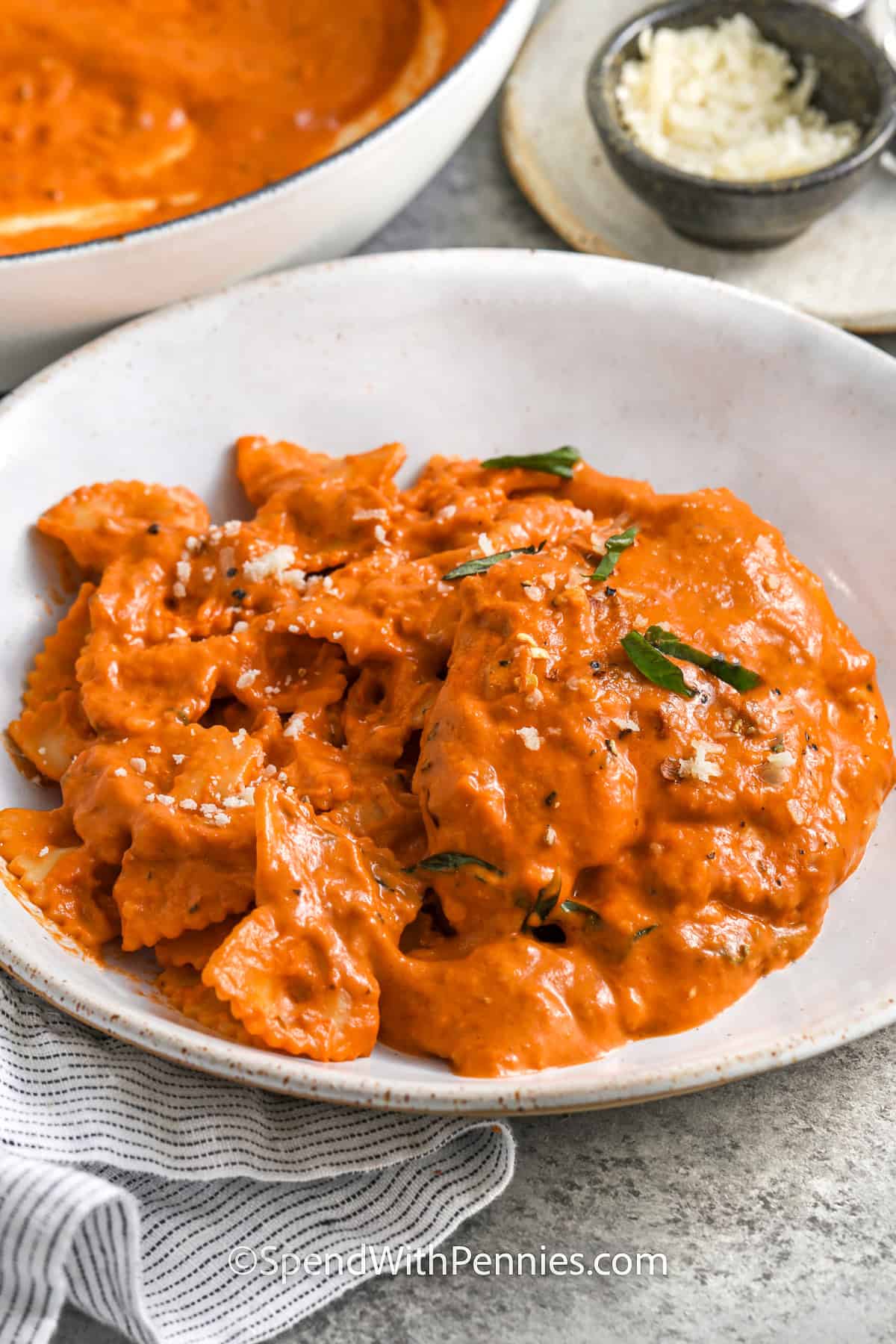 plate of Creamy Tomato Chicken Skillet with pot full in the back