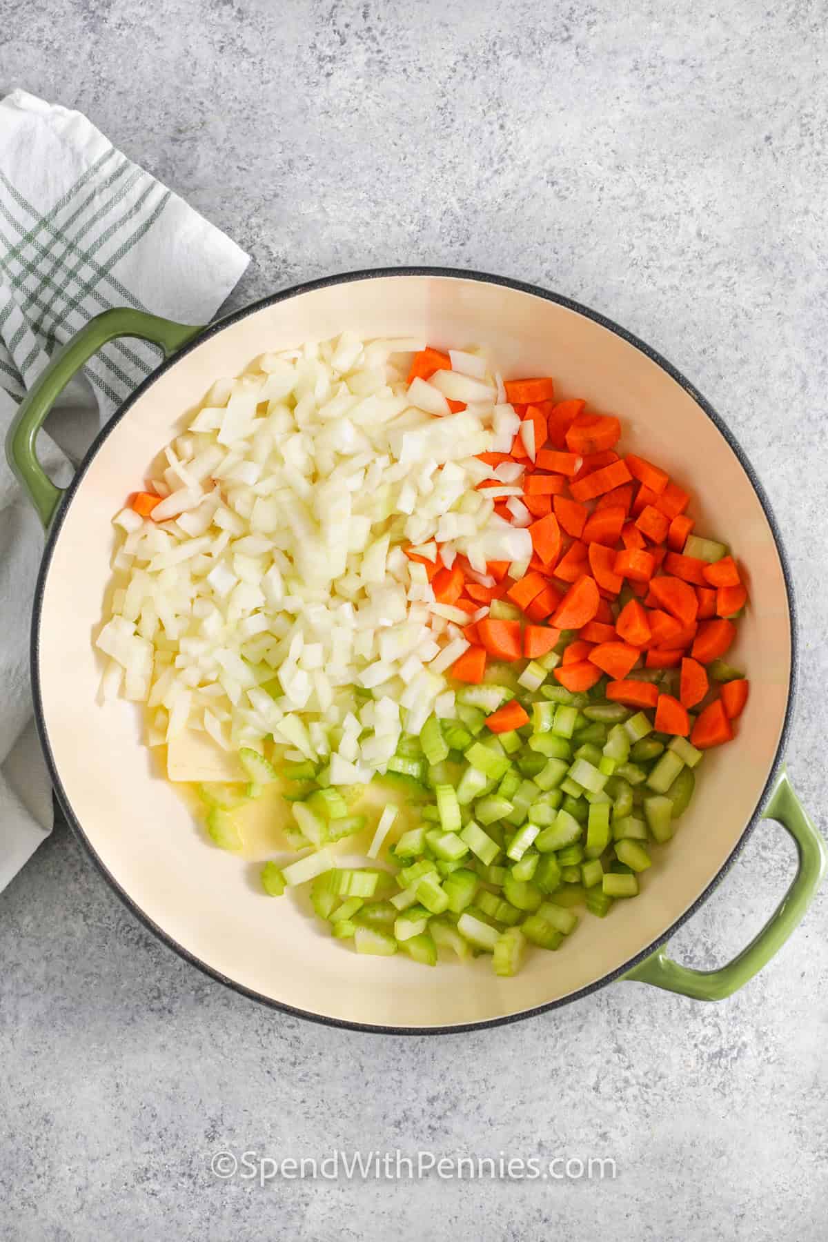 adding veggies with oil to the pot to make Dill Pickle Soup