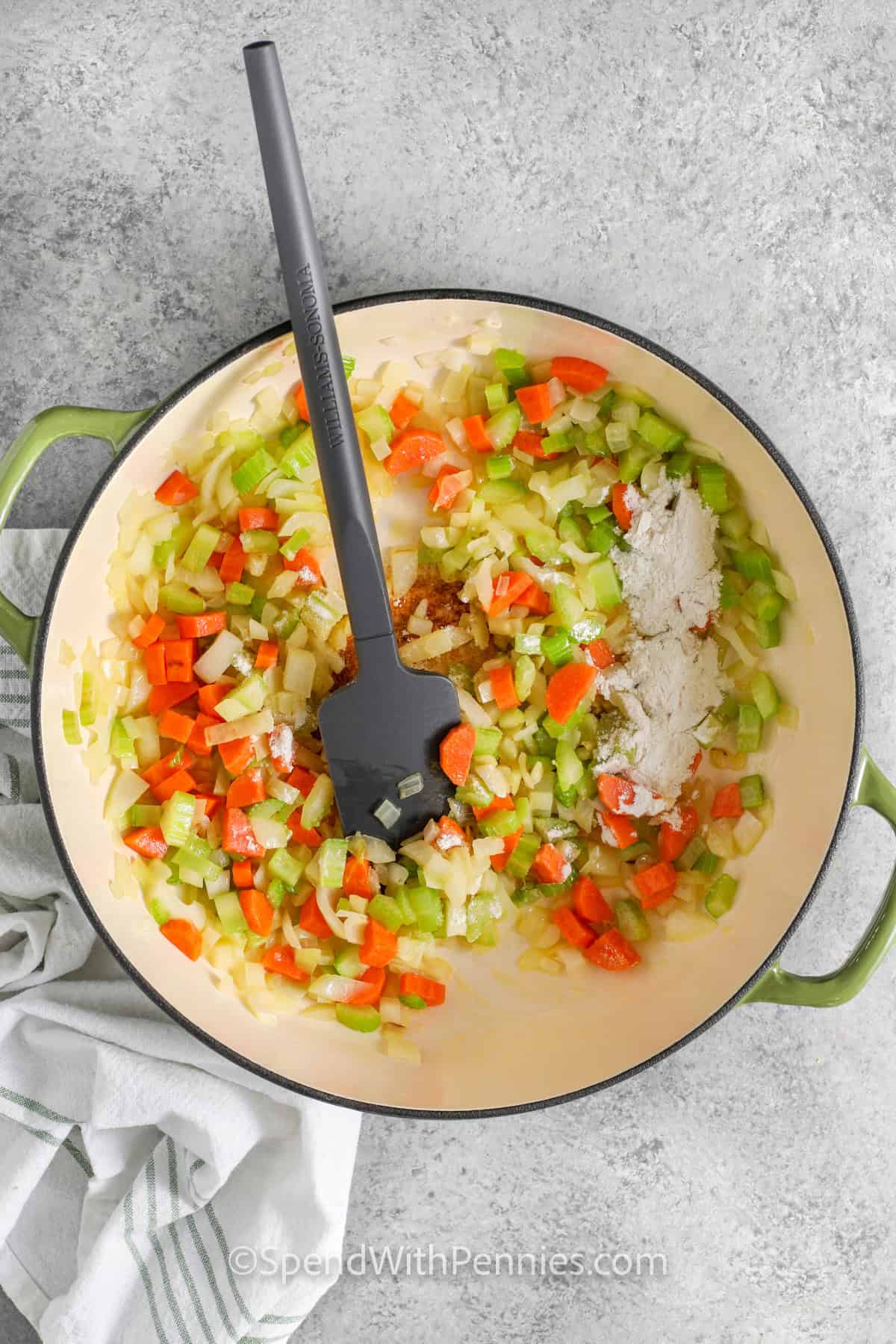 adding flour to veggies to make Dill Pickle Soup