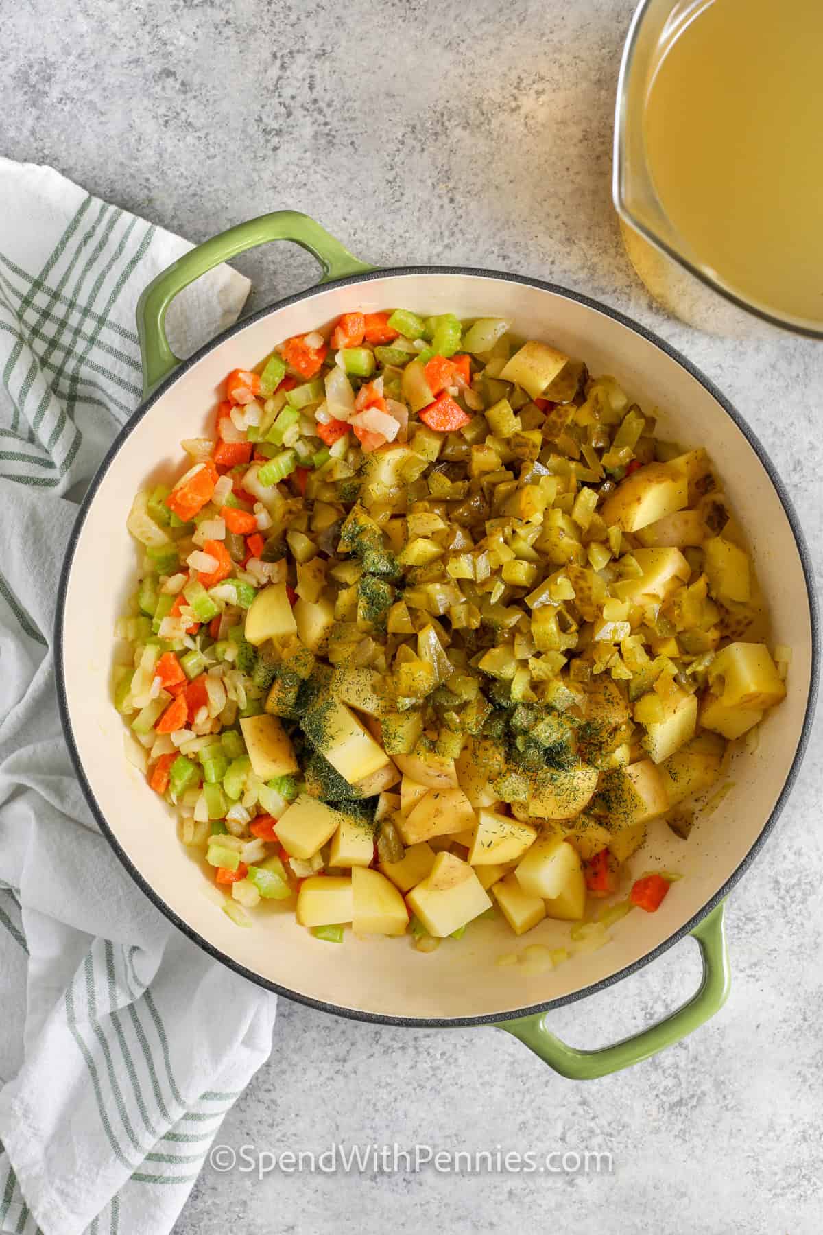 adding pickles and potatoes to veggie mixture to make Dill Pickle Soup