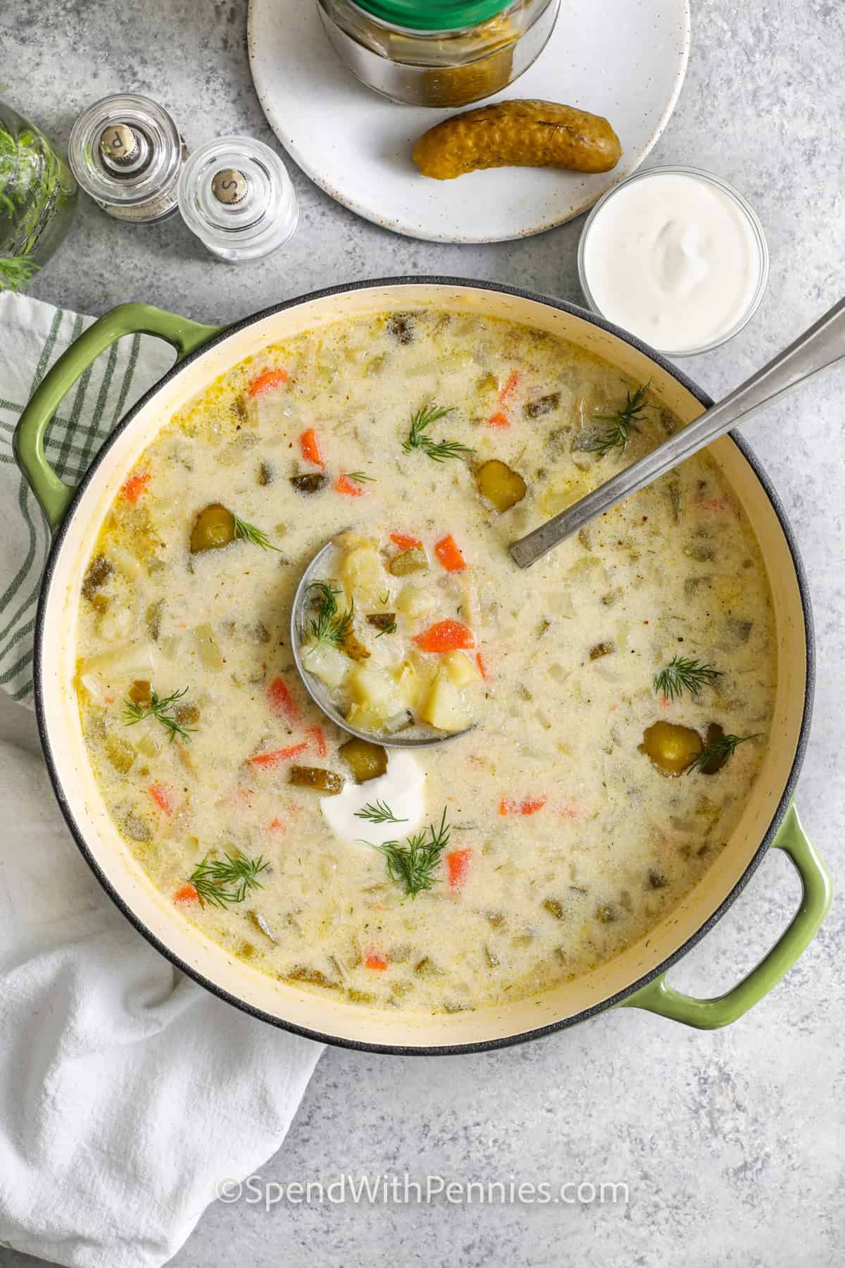 Dill Pickle Soup in a pot with a laddle