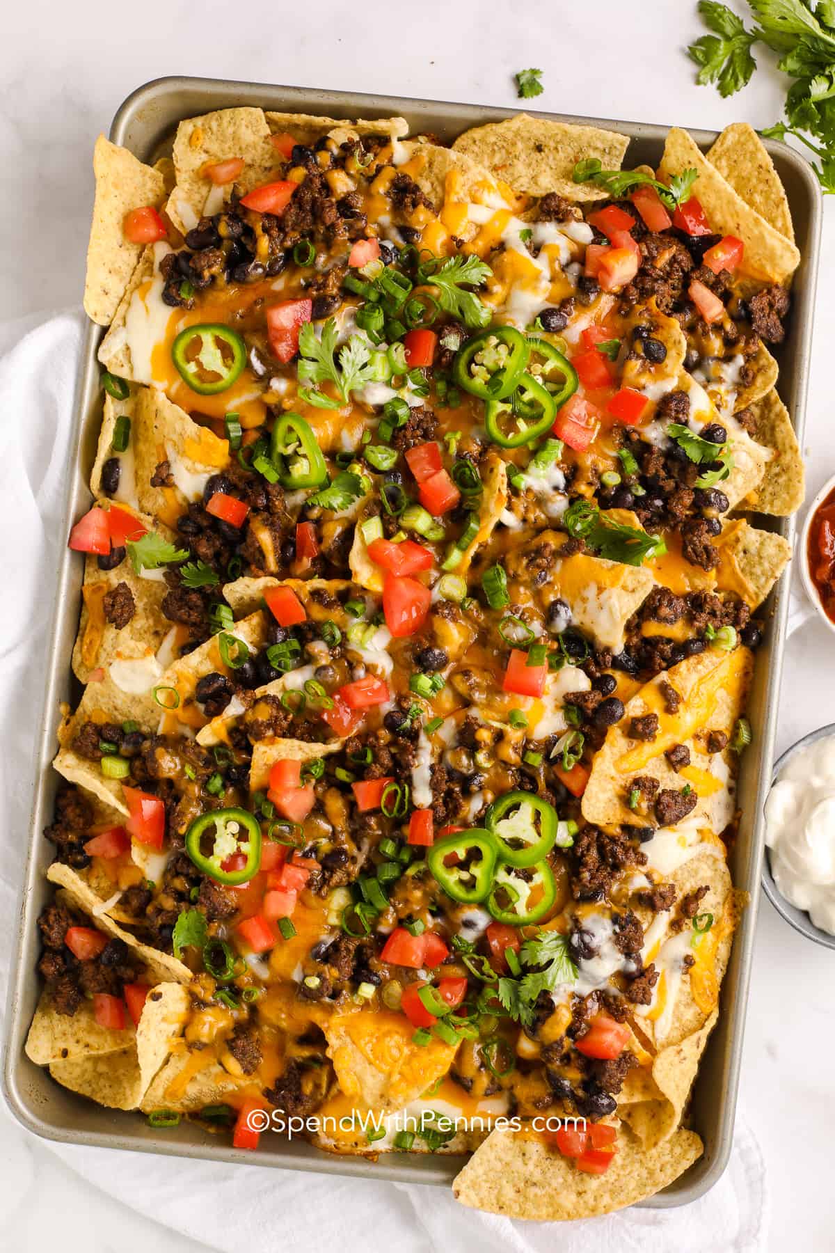 nachos on a pan after baking