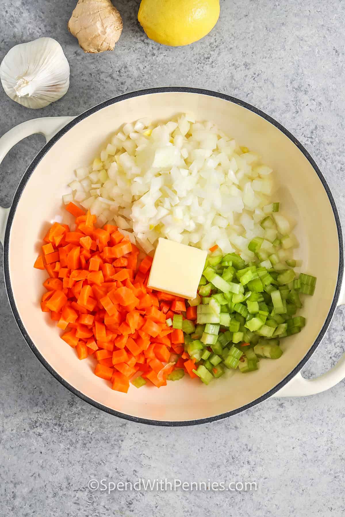 adding butter to vegetables in pot to make Feel Better Chicken Soup