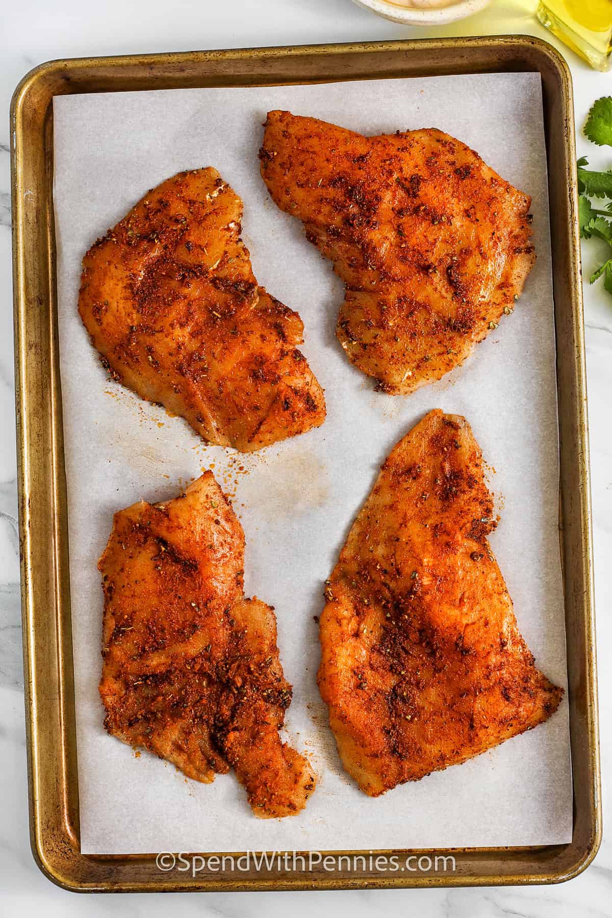 unbaked cod on a sheet pan for Fish Tacos