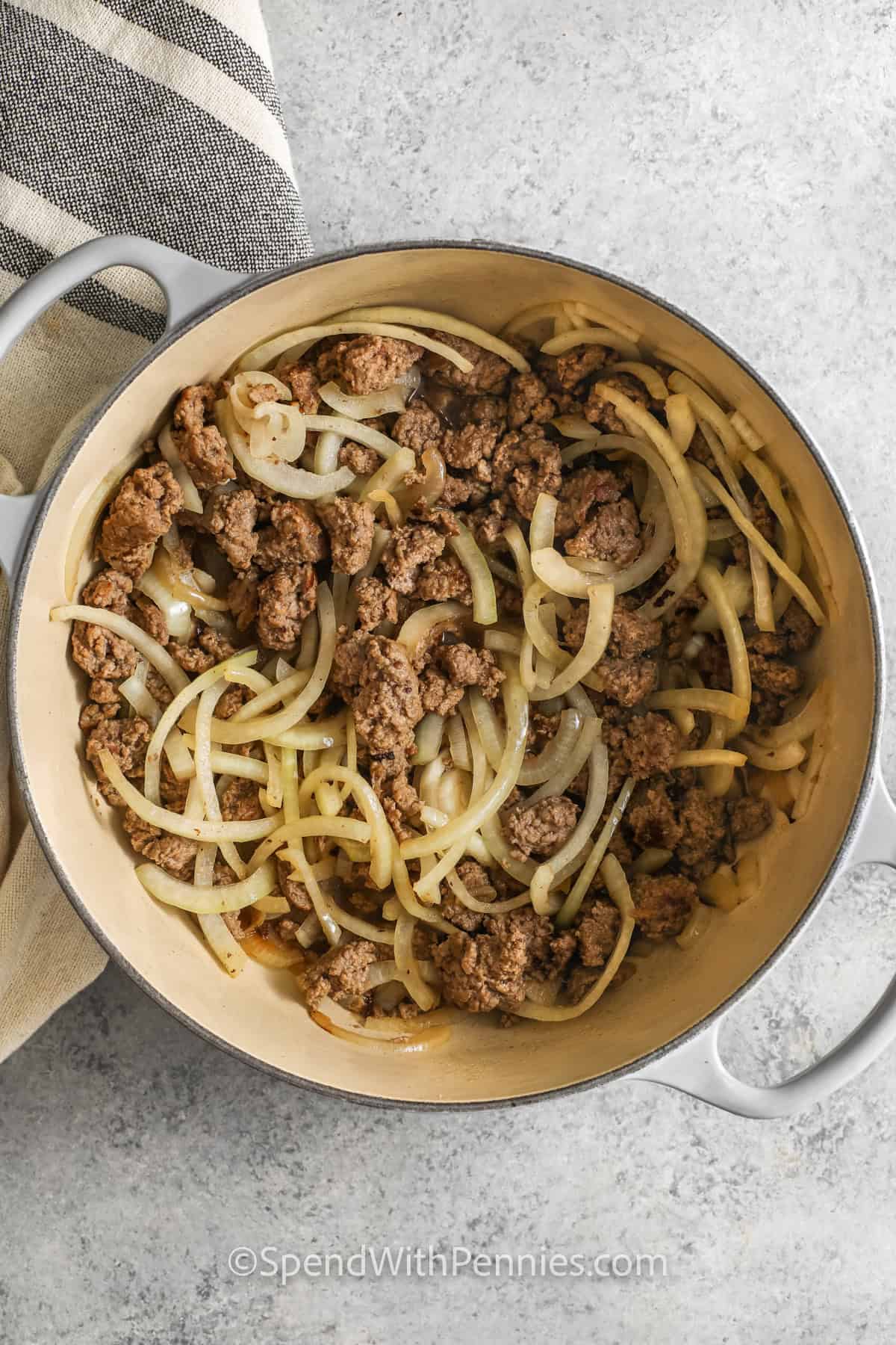 ground beef and onions in a dutch oven