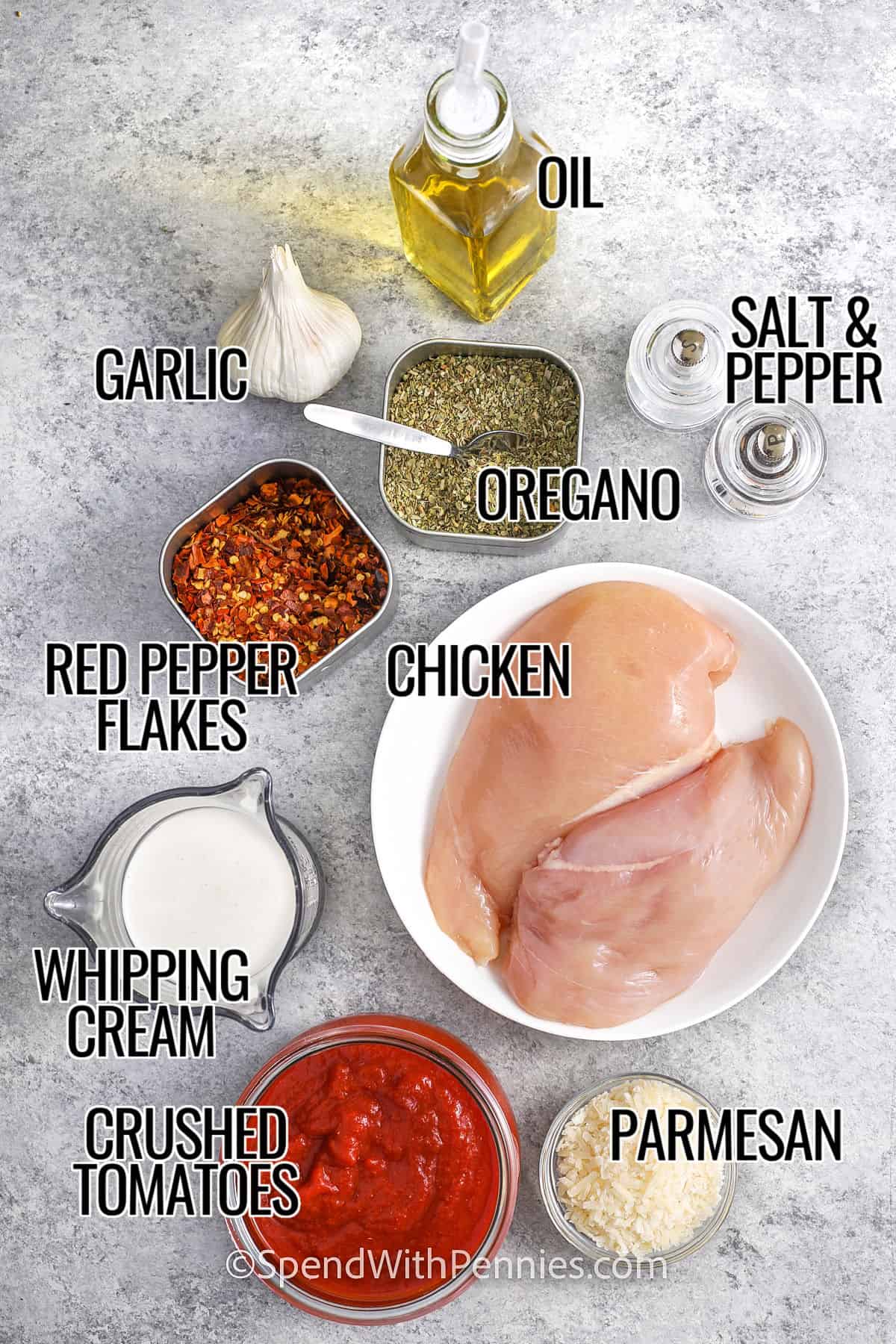 chicken , oil , oregano , garlic , red pepper flakes , whipping cream , crushed tomatoes , parmesan with labels to make Creamy Tomato Chicken Skillet