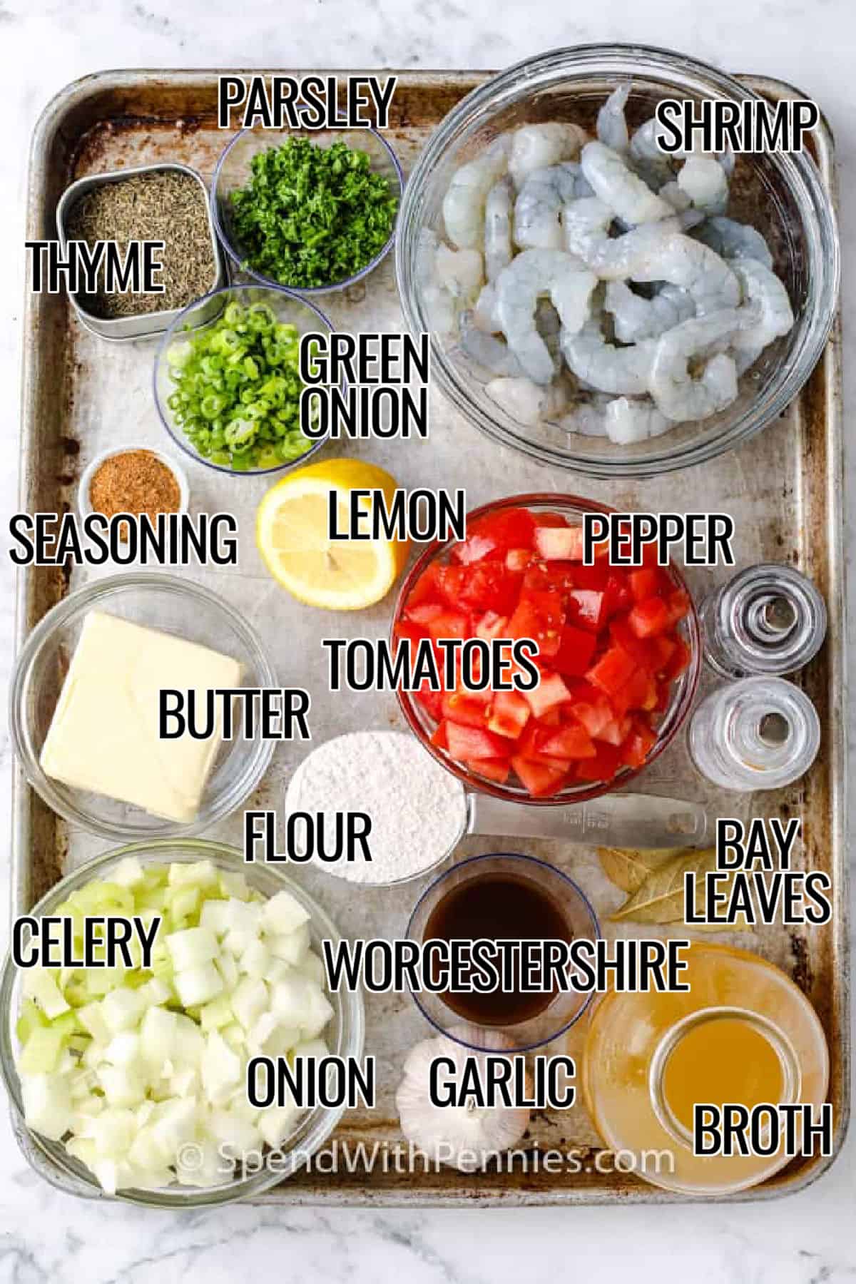 Ingredients for shrimp etouffee including thyme, parsley, shrimp, green onion, seasoning, lemon, tomatoes, salt & pepper, butter, flour, worcestershire, bay leaves, celery, onion, garlic, broth, with labels.