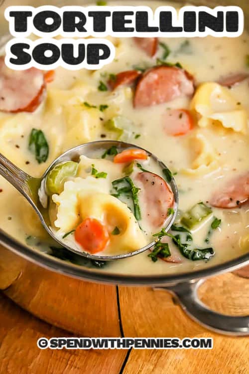 Creamy Tortellini Soup with sausage in a pot with a title