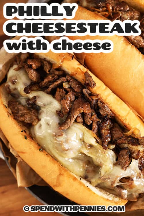 Philly Cheesesteaks with melted cheese on a title