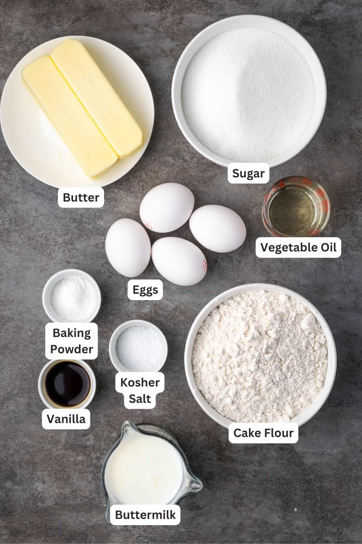 Ingredients for perfect vanilla cake with text labels overlaying each ingredient.