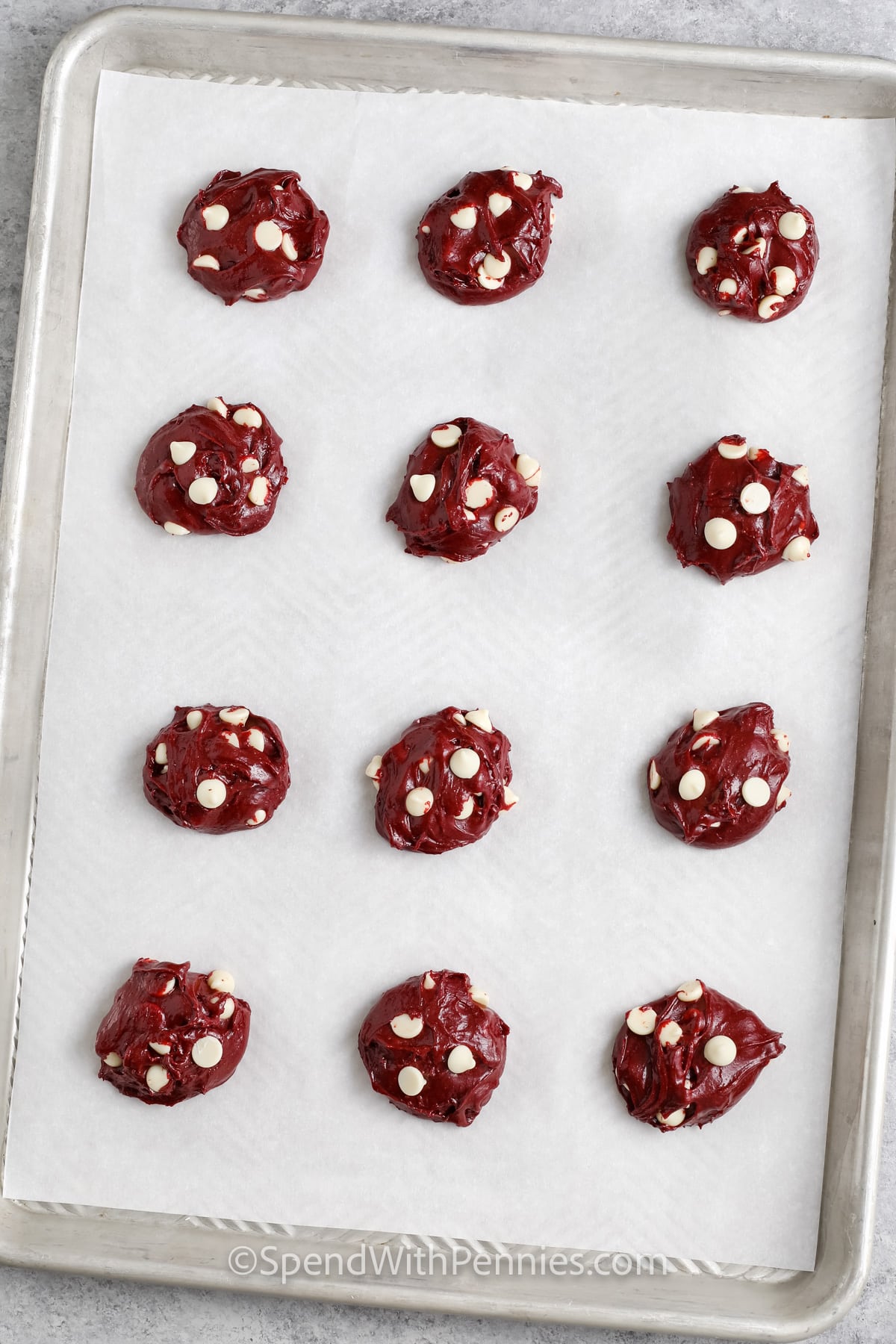 Red Velvet Cake Mix Cookies mix on a sheet pan