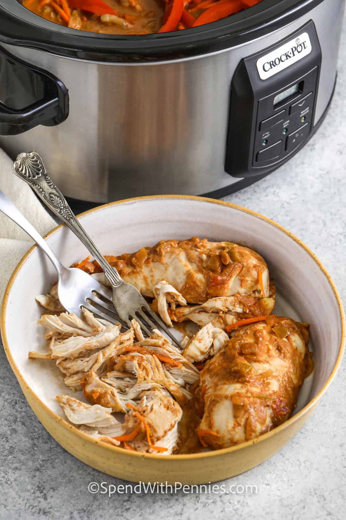 shredding chicken to make peanut noodles.